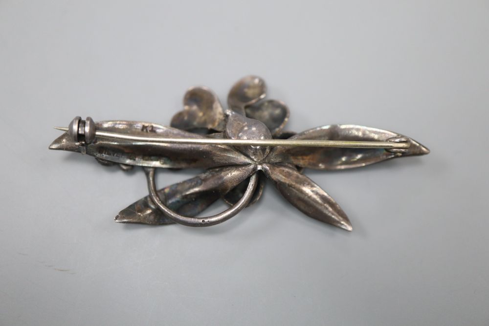 A continental 9ct and white metal (stamped silver) flower and leaf spray brooch, makers mark B.I.?, 62mm, gross 10 grams.
